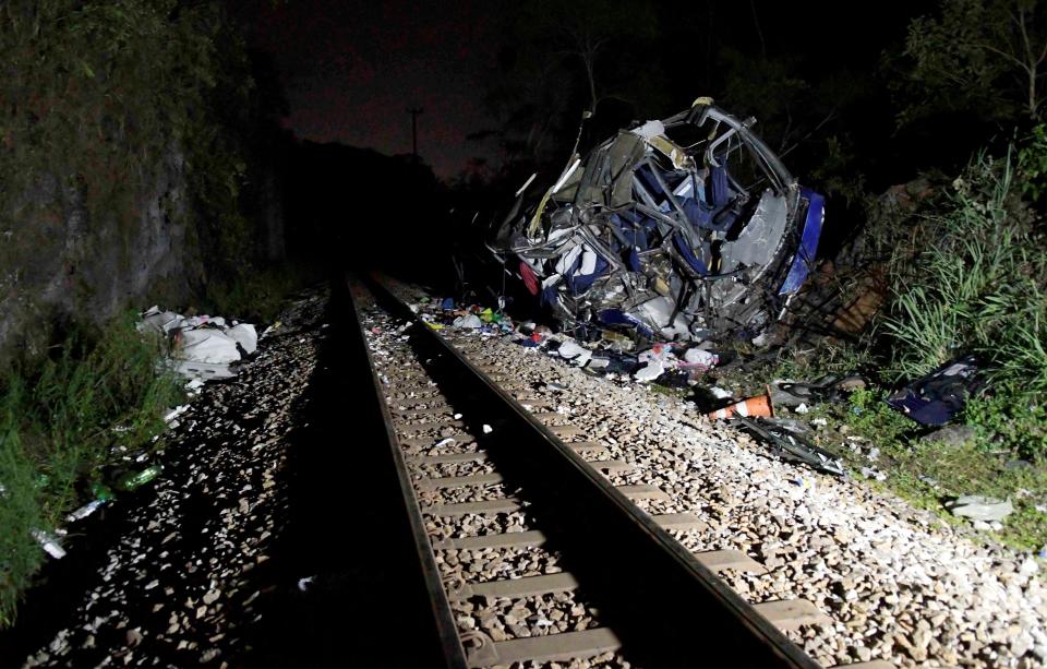 Bus fell 45 feet from overpass on to train tracks (Reuters)