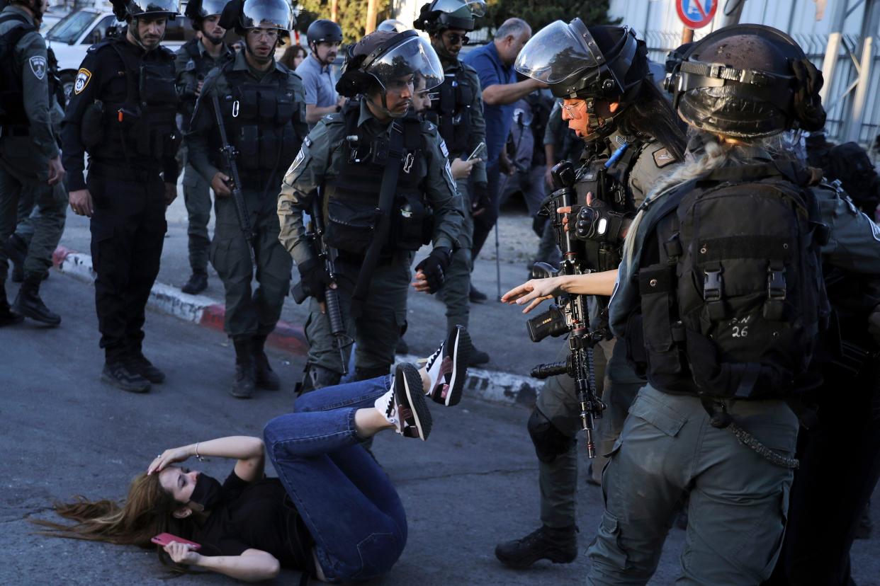 Israeli police scuffle with protesters in the Sheikh Jarrah neighborhood of east Jerusalem on Saturday, May 15, 2021. The tensions began in east Jerusalem earlier this month when Palestinians protested attempts by settlers to forcibly evict a number of Palestinian families from their homes.