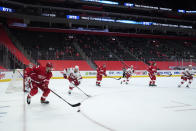 Detroit Red Wings defenseman Patrik Nemeth (22) clears the puck against the Carolina Hurricanes in front of a small crowd of family and friends at Little Caesars Arena in the first period of an NHL hockey game Thursday, Jan. 14, 2021, in Detroit. (AP Photo/Paul Sancya)