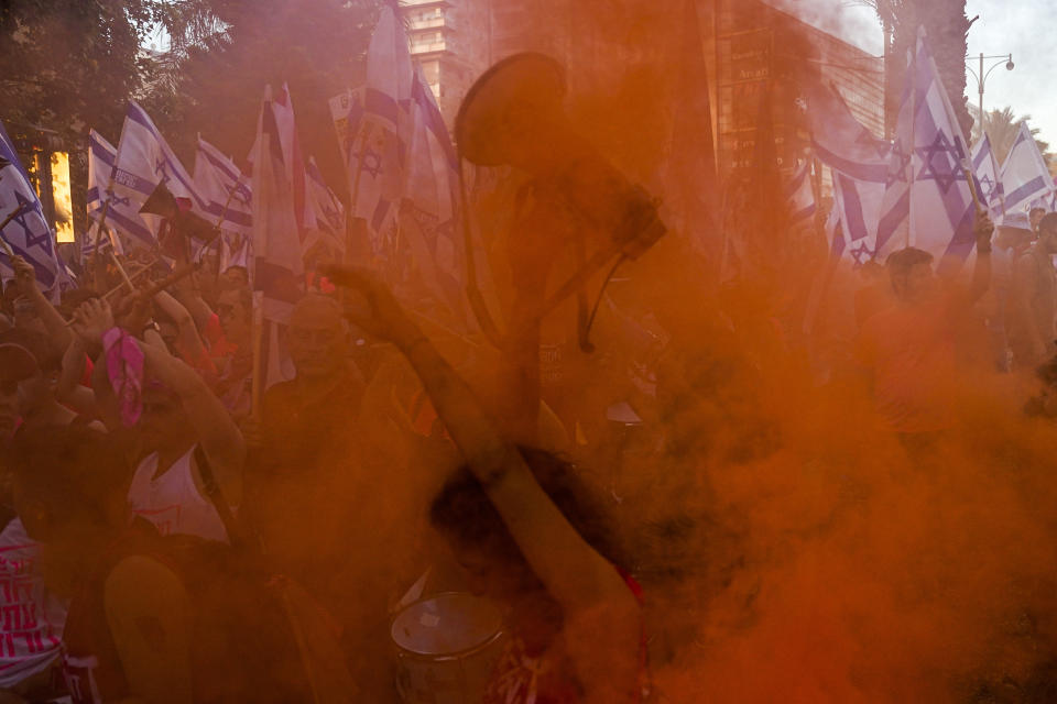 Israelis protest against plans by Prime Minister Benjamin Netanyahu's government to overhaul the judicial system in Tel Aviv, Israel, Saturday, July 15, 2023. (AP Photo/Ariel Schalit)