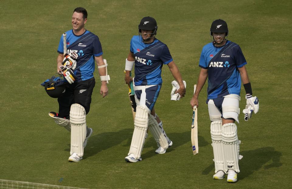 New Zealand's Matt Henry, left, Devon Conway, center, and Tim Southee, right, walk during a training session, in Karachi, Pakistan, Friday, Dec. 23, 2022. (AP Photo/Fareed Khan)