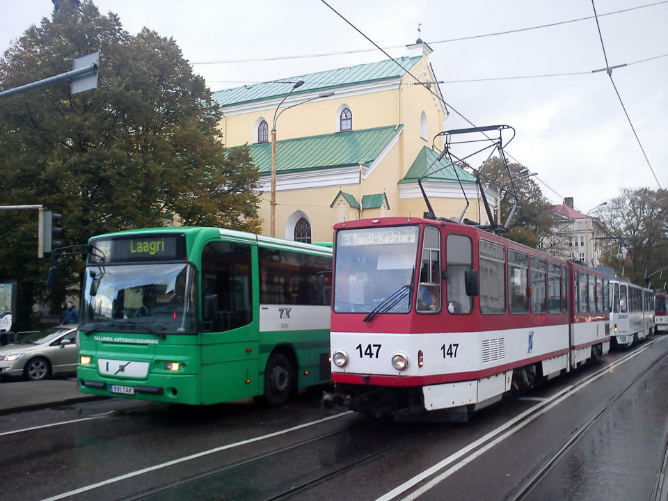 In this handout photo made available on Thursday April 4, 2013,l provided by the City of Tallinn, a public bus and a tram move side by side in the Estonian capital. Tallinn this year became the world’s first capital to introduce free public transport for all of its residents. (AP Photo/City of Tallinn)