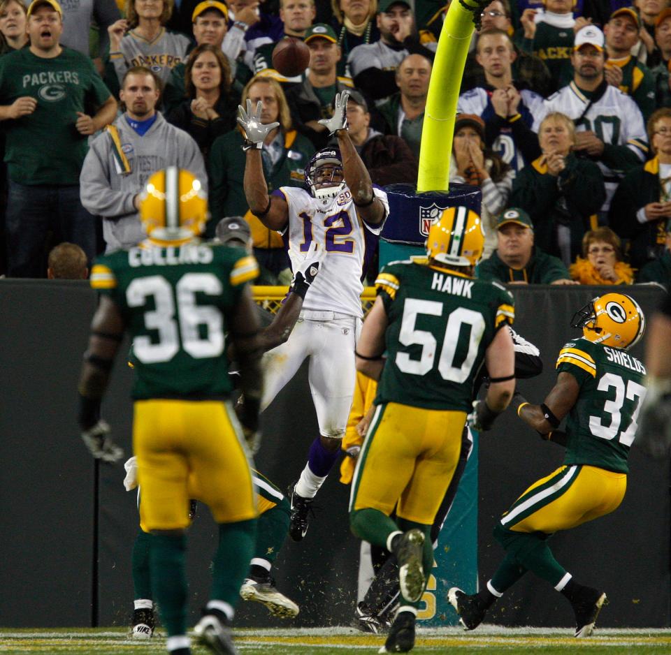 Minnesota Vikings receiver Percy Harvin jumps for an apparent game-winning touchdown catch against the Green Bay Packers, though replay overturned the call.