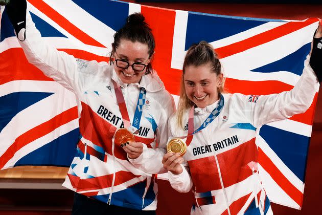 Gold medalist Katie Archibald, left, and Laura Kenny of Team Britain celebrate during a medal ceremony for the track cycling women's madison race at the 2020 Summer Olympics, Aug. 6, 2021, in Izu, Japan.