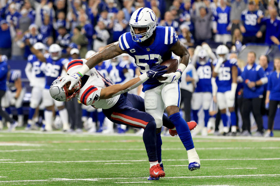 Indianapolis Colts outside linebacker Darius Leonard (53) pushes away New England Patriots wide receiver Jakobi Meyers after intercepting a pass during the first half of an NFL football game Saturday, Dec. 18, 2021, in Indianapolis. (AP Photo/Aaron Doster)