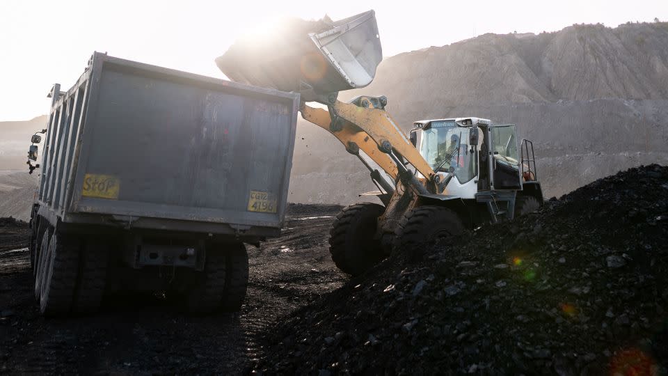 A loader fills a dump truck at the coal mine, operated by South Eastern Coalfields, in Chhattisgarh. - Anindito Mukherjee/Bloomberg/Getty Images