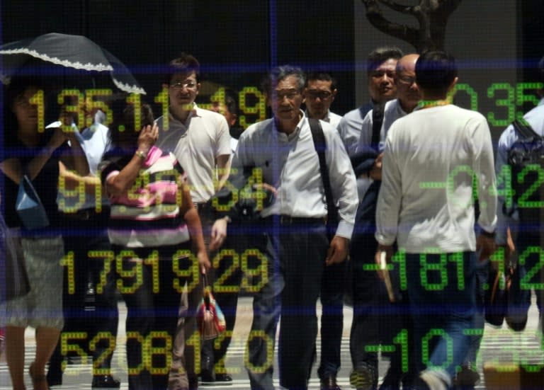 Asian markets have mostly risen, tracking a second straight rally in New York, while the dollar also pushed higher after the Federal Reserve upgraded its outlook on the US economy