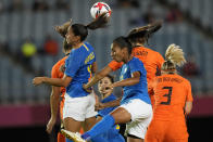 Brazil and Netherlands players battle for a header during a women's soccer match at the 2020 Summer Olympics, Saturday, July 24, 2021, in Miyagi, Japan. (AP Photo/Andre Penner)