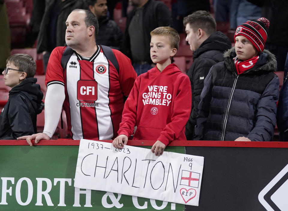 Sheffield United fans in the stands with a tribute in memory of Sir Bobby Charlton. Picture: Danny Lawson/PA Wire