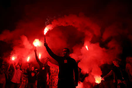 Protesters against a banned referendum on independence in Catalonia hold flares during a demonstration in Barcelona, Spain, September 22, 2017. REUTERS/Susana Vera