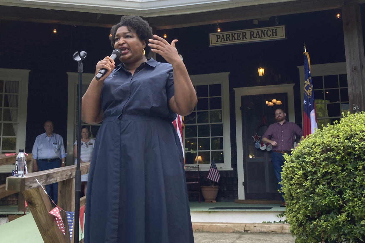 FILE - Georgia Democratic candidate for governor Stacey Abrams speaks on July 28, 2022, during a rally in Clayton, Ga. Four years ago, Georgia Democrats had a contested primary for governor because the party old guard didn’t believe in Stacey Abrams. She blew away the elders’ alternative and, in a close general election loss, established herself as de facto party boss in a newfound battleground. (AP Photo/Jeff Amy, File)