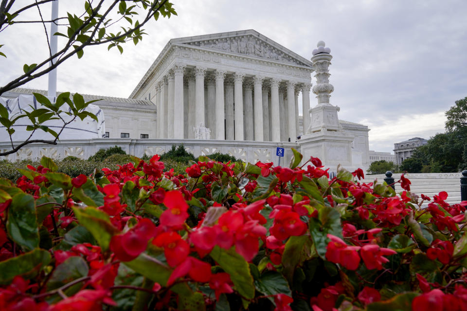 In this Oct. 4, 2021 photo, the Supreme Court is seen on the first day of the new term, in Washington. Abortion already is dominating the Supreme Court’s new term, months before the justices will decide whether to reverse decisions reaching back nearly 50 years. Not only is there Mississippi’s call to overrule Roe v. Wade, but the court also soon will be asked again to weigh in on the Texas law banning abortion at roughly six weeks. (AP Photo/J. Scott Applewhite)