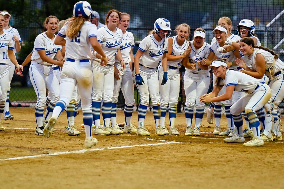 Van Meter players celebrate as Finley Netten scores a home run during a game against Earlham on Monday, June 5, 2023.