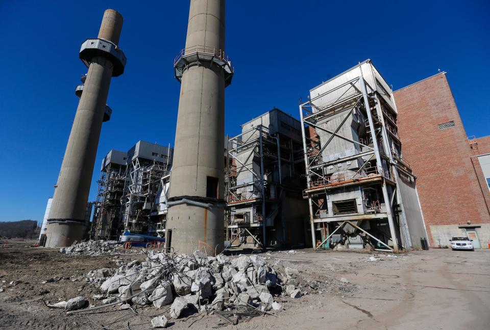 Construction crews demolish equipment at the James River Power Station on Monday, Jan. 31, 2022. The smokestacks at the decommissioned power plant are set to be imploded later this month. 