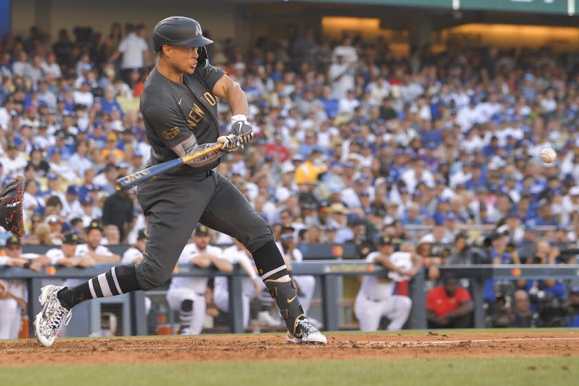 American League's Giancarlo Stanton, of the New York Yankees, swings at a pitch while hitting a two-run home run off National League pitcher Tony Gonsolin, of the Los Angeles Dodgers, during the fourth inning of the MLB All-Star baseball game, Tuesday, July 19, 2022, in Los Angeles. (AP Photo/Mark J. Terrill)