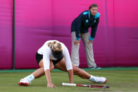 Sabine Lisicki of Germany slips on the grass and falls to the floor during the Women's Singles Tennis match against Ons Jabeur of Tunisia on Day 2 of the London 2012 Olympic Games at the All England Lawn Tennis and Croquet Club in Wimbledon on July 29, 2012 in London, England. (Photo by Clive Brunskill/Getty Images)