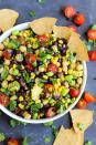 <p>Enjoy this sweet and summery bean salad as a side or dig right into it with tortilla chips. Or do both; there are no rules here.</p> <p>Get the recipe <a href="https://www.emilieeats.com/pineapple-three-bean-salad/" rel="nofollow noopener" target="_blank" data-ylk="slk:here" class="link ">here</a>.</p>