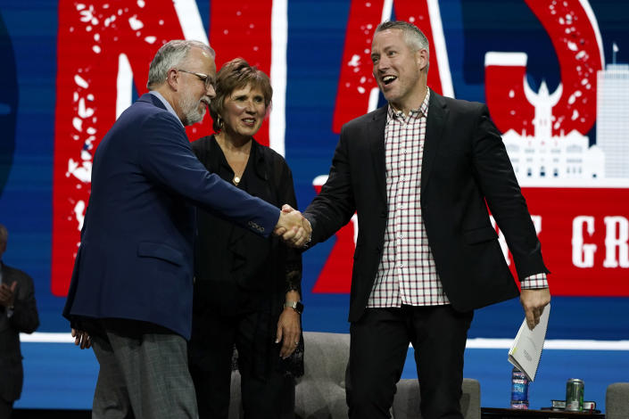 Outgoing Southern Baptist Convention President J. D. Greear, right, greets incoming President Ed Litton, left, and his wife, Kathy Litton, at the conclusion of the annual Southern Baptist Convention meeting Wednesday, June 16, 2021, in Nashville, Tenn. (AP Photo/Mark Humphrey)