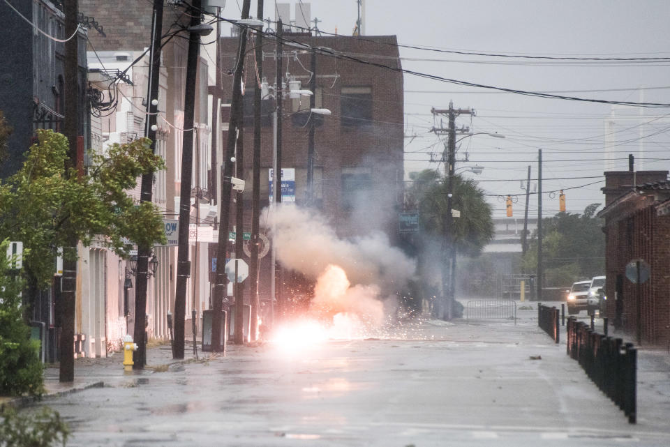 Power lines spark in flood water on Market Street as Hurricane Dorian spins just off shore on September 5, 2019 in Charleston, S.C.  (Photo: Sean Rayford/Getty Images)