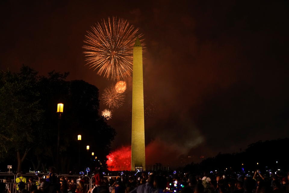 People enjoy the fireworks as they gather for the annual Independence Day celebration at the National Mall in Washington, U.S., July 4, 2021.  REUTERS/Joshua Roberts