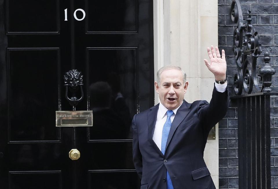 Prime Minister Benjamin Netanyahu of Israel waves to the media as he arrives to meet Britain's Prime Minister Theresa May at Downing Street in London, Monday, Feb. 6, 2017. (AP Photo/Kirsty Wigglesworth)