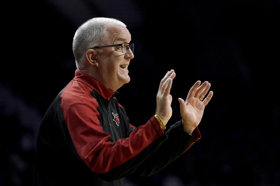 FILE - Omaha head coach Derrin Hansen talks to his players during the first half of an NCAA college basketball game against Kansas State, Wednesday, Nov. 17, 2021, in Manhattan, Kan. On Sunday, March 6, 2022, Hansen, who coached Omaha during its transition from Division II to Division I, was fired after a second straight five-win season. (AP Photo/Charlie Riedel, File)