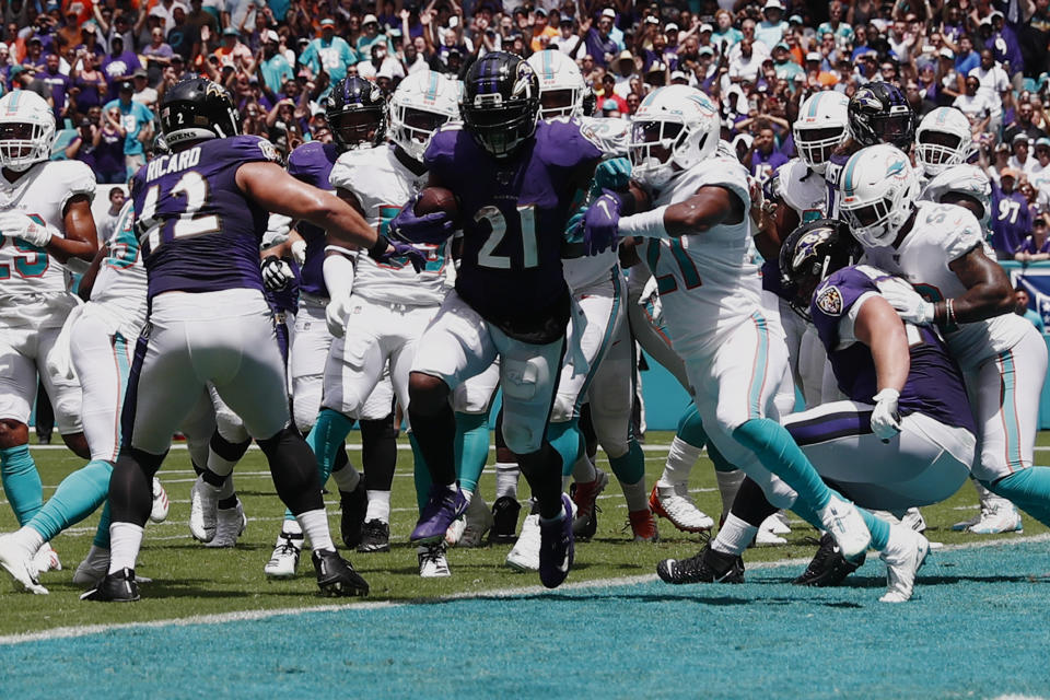 Baltimore Ravens running back Mark Ingram (21) scores a touchdown, during the first half at an NFL football game against the Miami Dolphins, Sunday, Sept. 8, 2019, in Miami Gardens, Fla. (AP Photo/Brynn Anderson)