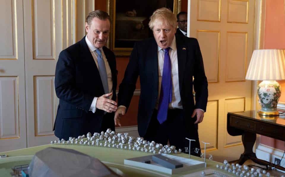 Prime Minister Boris Johnson and Tom Samson, Chief Executive Officer of Rolls Royce SMR look at a model of a Rolls Royce Nuclear Power plant after attending a roundtable meeting with leading figures from the Nuclear Energy in 10 Downing Street - Simon Dawson / No10 Downing Street