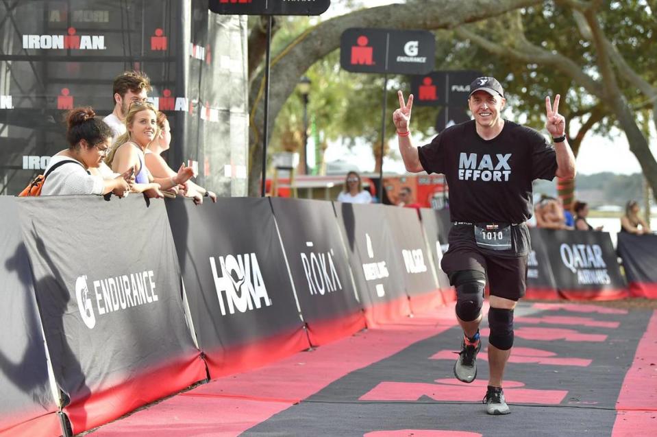 Max Savar is all smiles as he runs down the chute toward the finish line at Ironman 70.3 Florida last December.