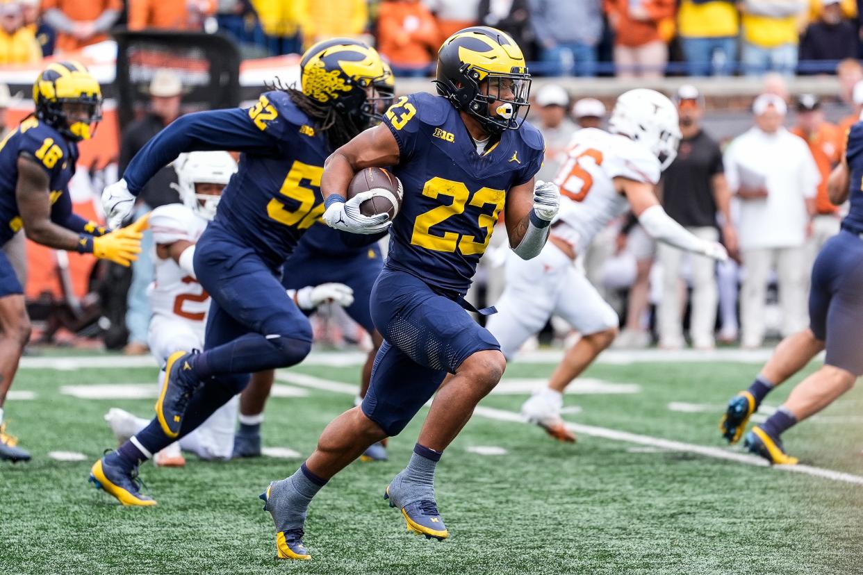 Michigan running back Jordan Marshall (23) returns a kickoff from Texas during the second half at Michigan Stadium in Ann Arbor on Saturday, September 7, 2024.