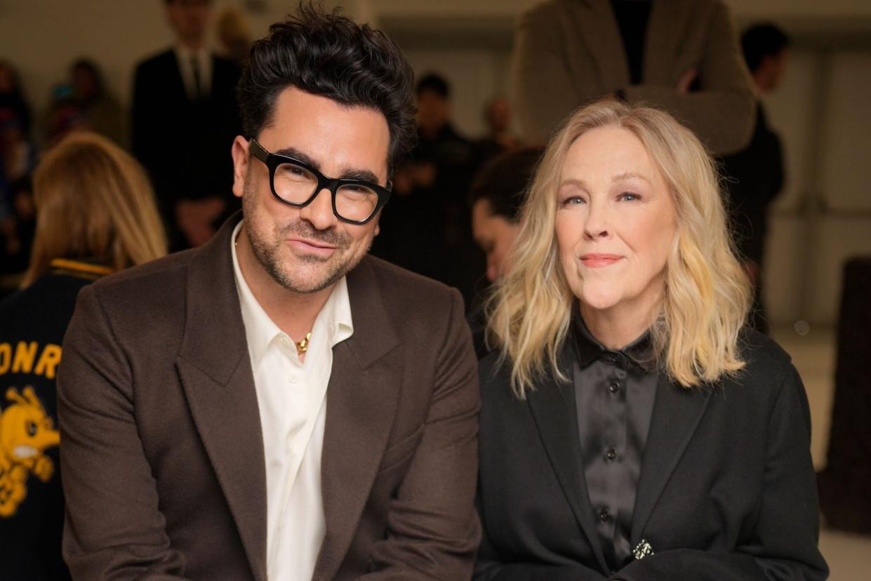 PARIS, FRANCE - MARCH 03: Dan Levy and Catherine O'Hara at Loewe Fall 2023 Ready To Wear Runway Show on March 3, 2023 at Chateau de Vincennes in Paris, France. (Photo by Swan Gallet/WWD via Getty Images)