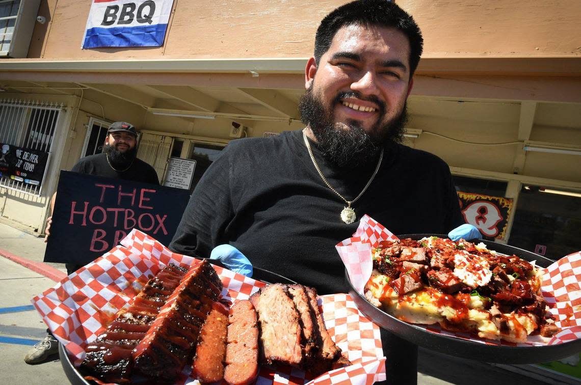 Longtime buddies Esteban Guiverra, right, and Ivan Matamoros, are fulfilling their dream of having their own eatery, The Hotbox BBQ, inside a Valero gas station at Maple and Shields avenues.