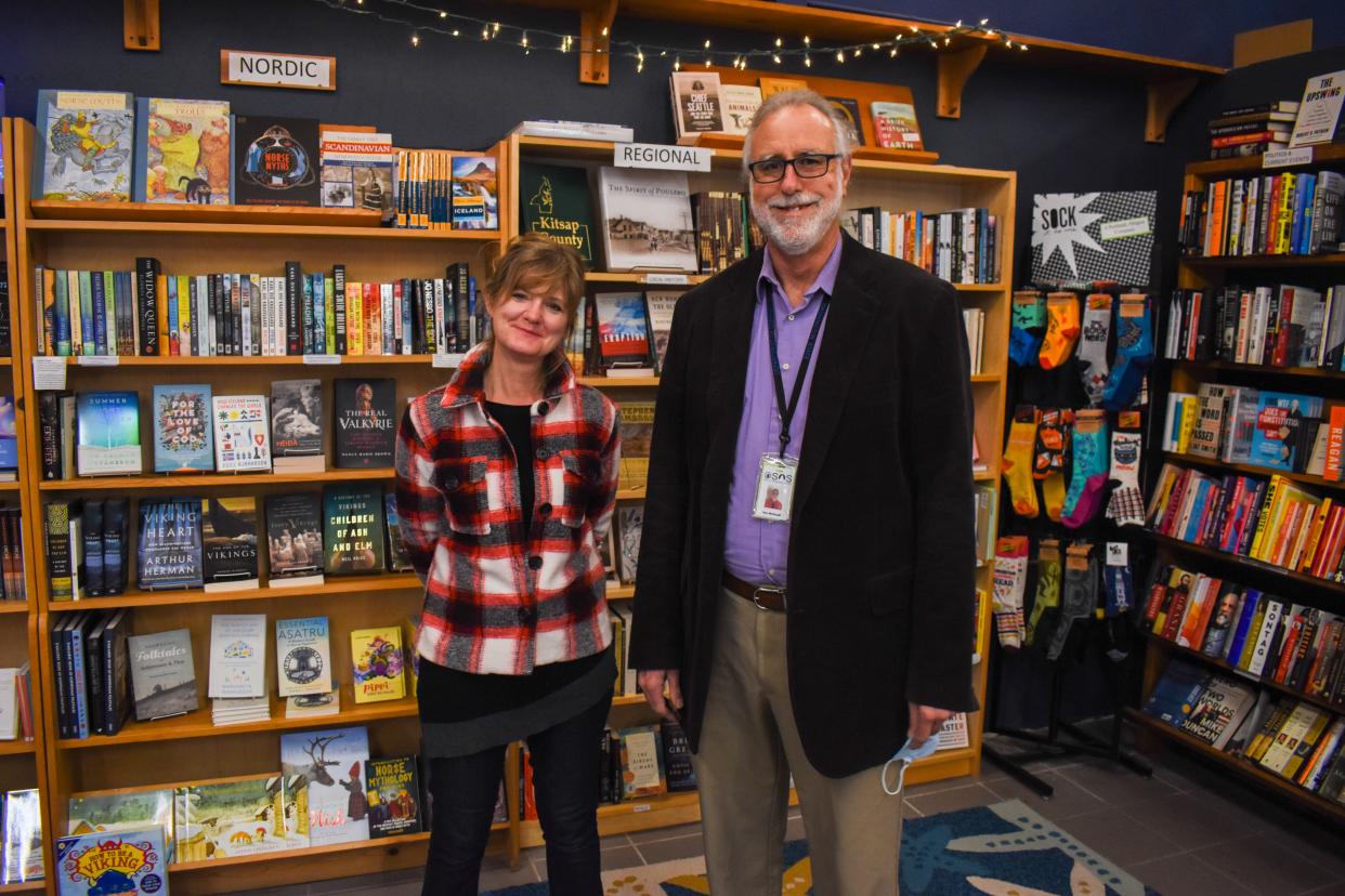 Suzanne Selfors, owner of Liberty Bay Books in Poulsbo, stands in her shop with Ken McDouall, Branch Librarian at Washington Corrections Center for Women. They are working together to provide new books to the incarcerated women at WCCW.