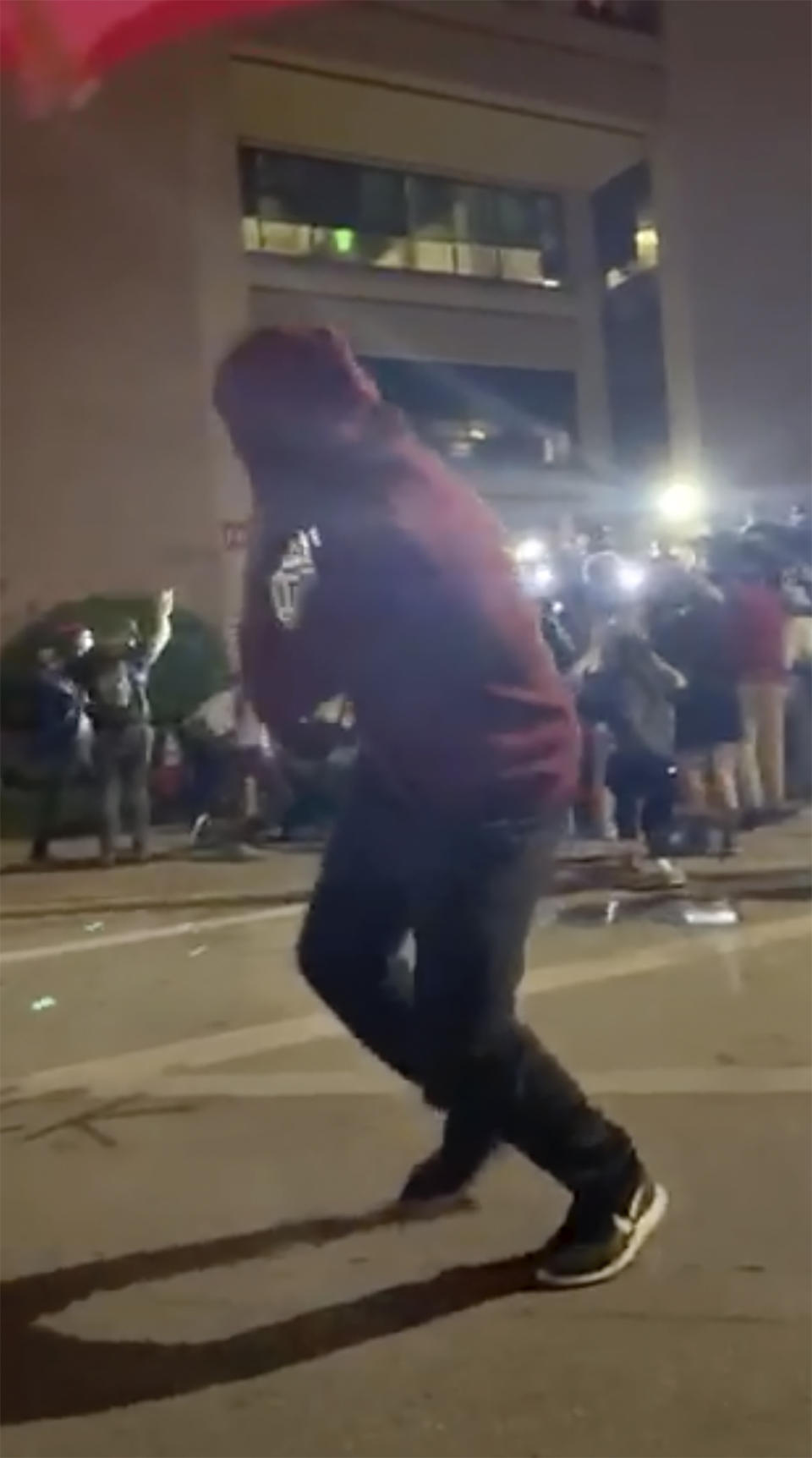 This still image taken from video provided by David Frost shows protesters running after police fire beanbag rounds in front of the Austin Police Department Headquarters on May 31, 2020 during a demonstration against police brutality in Austin, Texas. In some instances, police reacted with force so extreme that while their intent may not be to kill, the effects were devastating. (David Frost via AP)