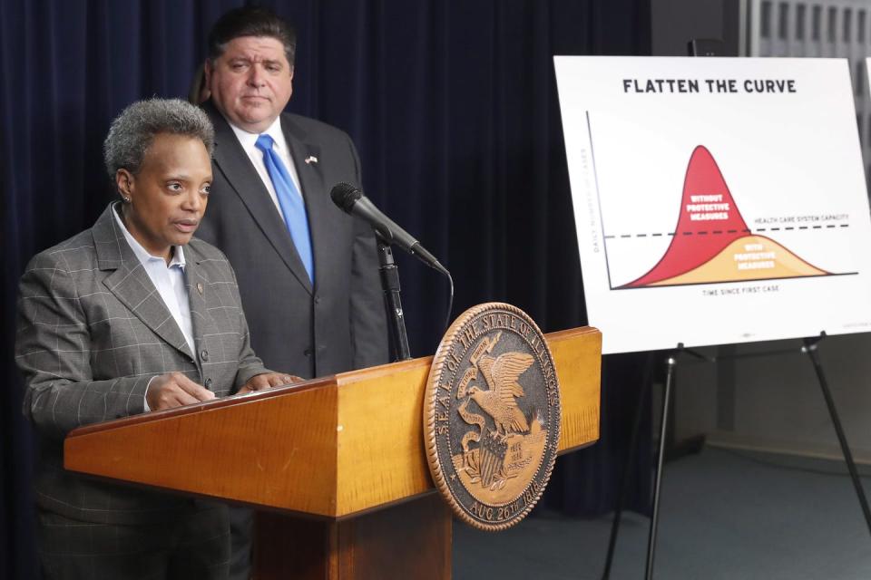 Chicago Mayor Lori Lightfoot speaks after Illinois Gov. J.B. Pritzker announced a shelter-in-place order to combat the spread of COVID-19 on March 20, 2020. (AP Photo/Charles Rex Arbogast)