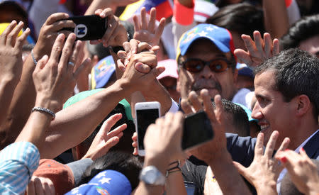 Venezuelan opposition leader and self-proclaimed interim president Juan Guaido is greeted by supporters during a rally against Venezuelan President Nicolas Maduro's government in Caracas, Venezuela February 2, 2019. REUTERS/Andres Martinez Casares