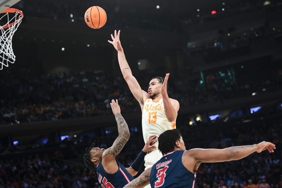 Tennessee forward Olivier Nkamhoua (13) takes a shot during a NCAA Tournament Sweet 16 game between <a class="link " href="https://sports.yahoo.com/ncaab/teams/tennessee/" data-i13n="sec:content-canvas;subsec:anchor_text;elm:context_link" data-ylk="slk:Tennessee;sec:content-canvas;subsec:anchor_text;elm:context_link;itc:0">Tennessee</a> and FAU in Madison Square Garden, Thursday, March 23, 2023.