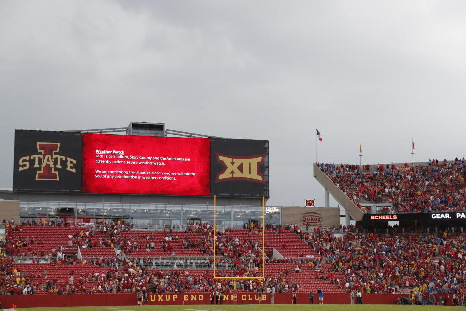 Fans are asked to leave the stadium after lightning was spotted during the first half as South Dakota State takes on Iowa State in an NCAA college football game, Saturday, Sept. 1, 2018, in Ames, Iowa. (AP Photo/Matthew Putney)