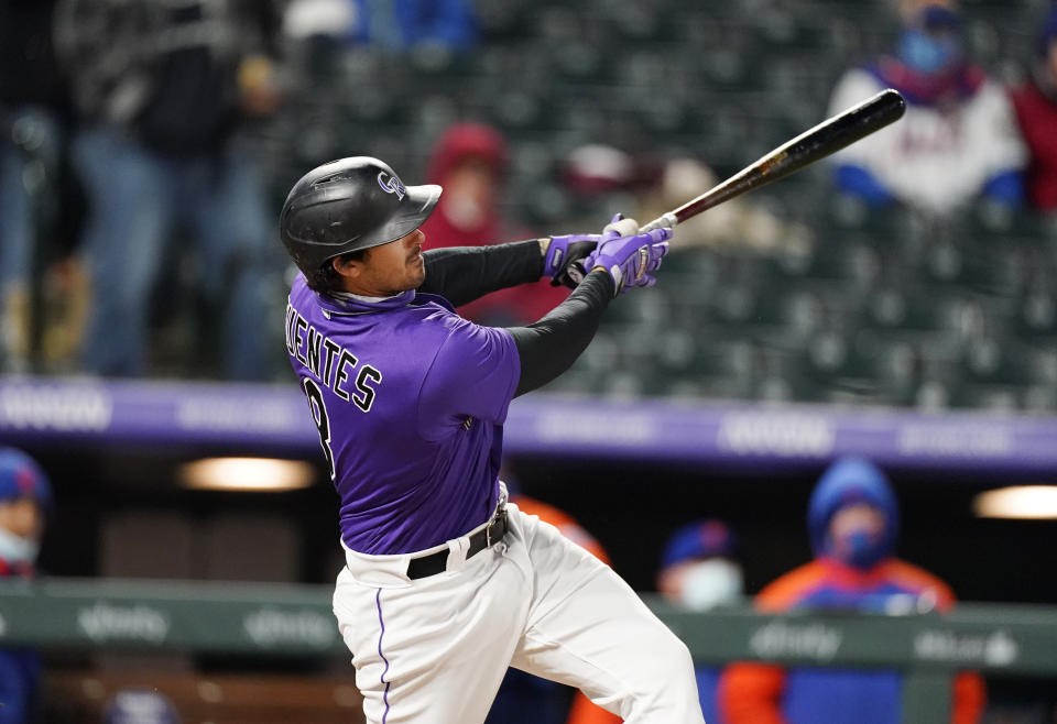 Colorado Rockies' Josh Fuentes watches his three-run home run off New York Mets relief pitcher Jacob Barnes during the fifth inning of the second game of a baseball doubleheader Saturday, April 17, 2021, in Denver. (AP Photo/David Zalubowski)