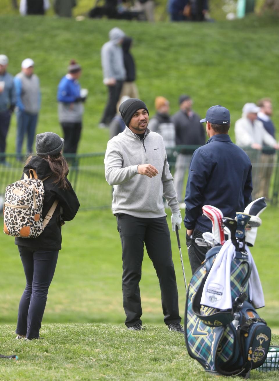 Jason Day chats with people in the practice area which was full of golfers warming up.