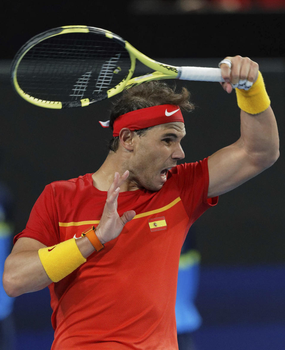 Rafael Nadal of Spain plays a ball from Nikoloz Basilashvili of Georgia during their ATP Cup tennis match in Perth, Australia, Saturday, Jan. 4, 2020. (AP Photo/Trevor Collens)