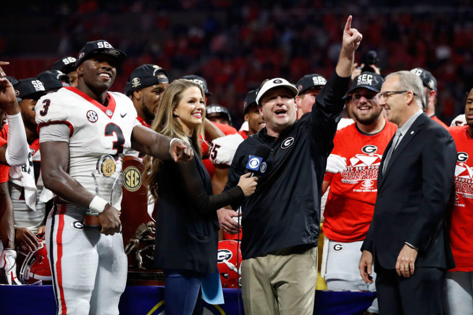 Roquan Smith, Kirby Smart and the Georgia Bulldogs celebrate.