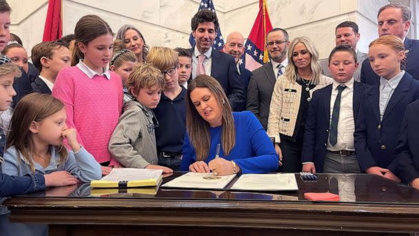 PHOTO: Arkansas Gov. Sarah Huckabee Sanders signs into law an education overhaul bill on March 8, 2023, at the state Capitol in Little Rock, Ark. (Andrew Demillo/AP)