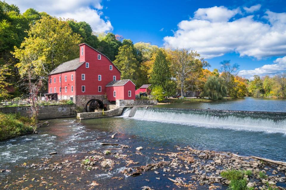 <p>The historic, bright red mill in Clinton, New Jersey is a bright spot on the Raritan River. </p>