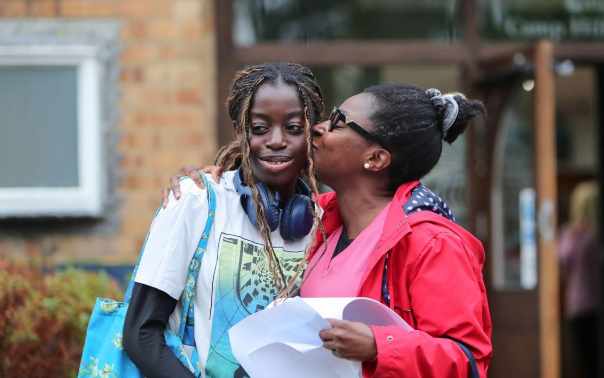 Rinsola Alatise celebrates with her proud mother after receiving 11 grade 9s at King Edward VI Camp Hill School for Girls, Kings Heath, Birmingham