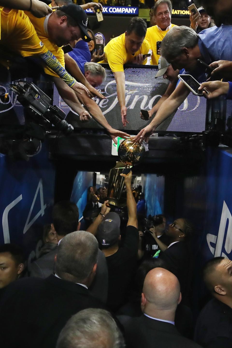 <p>Stephen Curry #30 of the Golden State Warriors carries off the Larry O’Brien Championship Trophy after defeating the Cleveland Cavaliers 129-120 in Game 5 to win the 2017 NBA Finals at ORACLE Arena on June 12, 2017 in Oakland, California. </p>