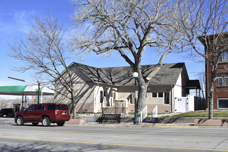 A vehicle passes the Wellspring Health Access clinic in Casper, Wyo., on Monday, April 24, 2023. The mayor of Casper has apologized for posting an image of a fire on Facebook in response to the abortion clinic opening in his city almost a year after an arson attack on the facility. (AP Photo/Matthew Brown)