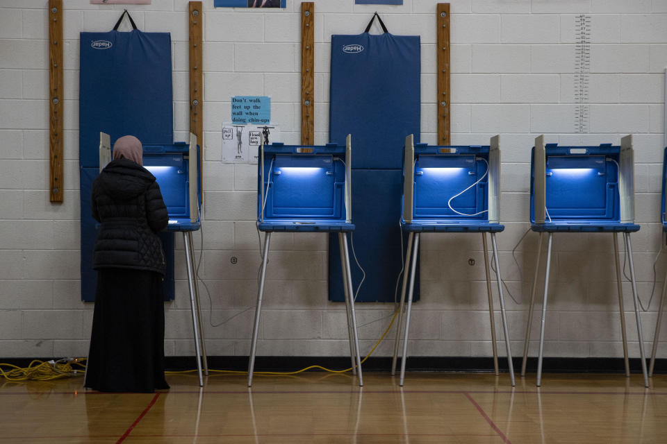 People vote at a voting site as Democrats and Republicans hold their Michigan primary presidential election in Dearborn, Michigan, United States on February 27, 2024. / Credit: Mostafa Bassim/Anadolu via Getty Images