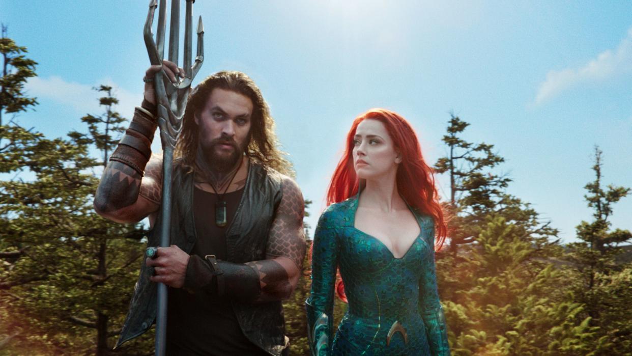 Jason Momoa and Amber Heard in a scene from the film, "Aquaman." 