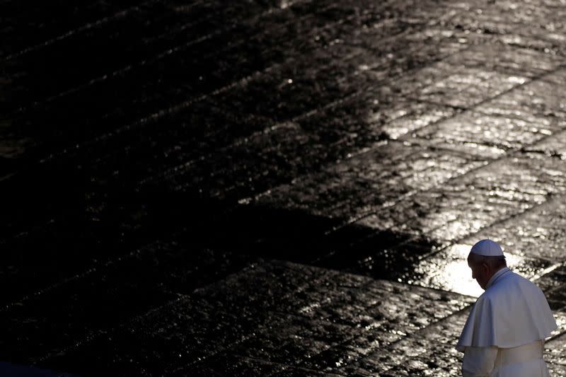 FILE PHOTO: Pope Francis delivers an extraordinary blessing from St. Peter's Square during the outbreak of coronavirus disease (COVID-19), at the Vatican